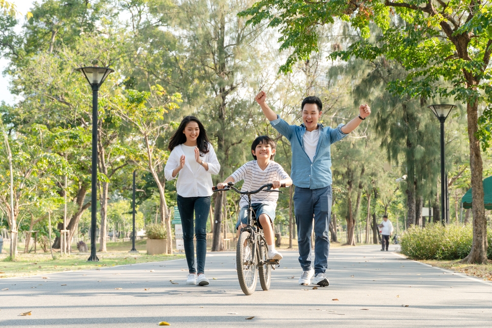 happy family exercising in the summer